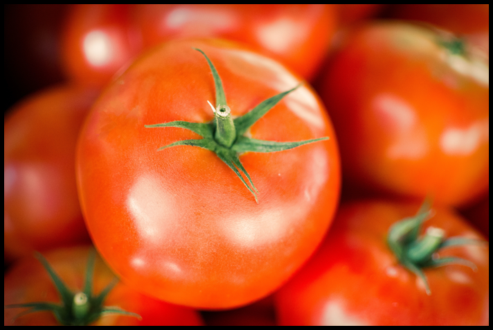 A close up of a ripe, fresh tomato.